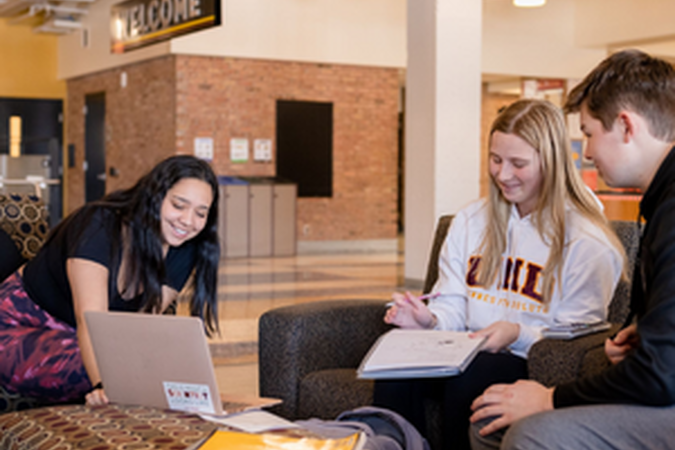students studying in the Kirby Student Center on campus